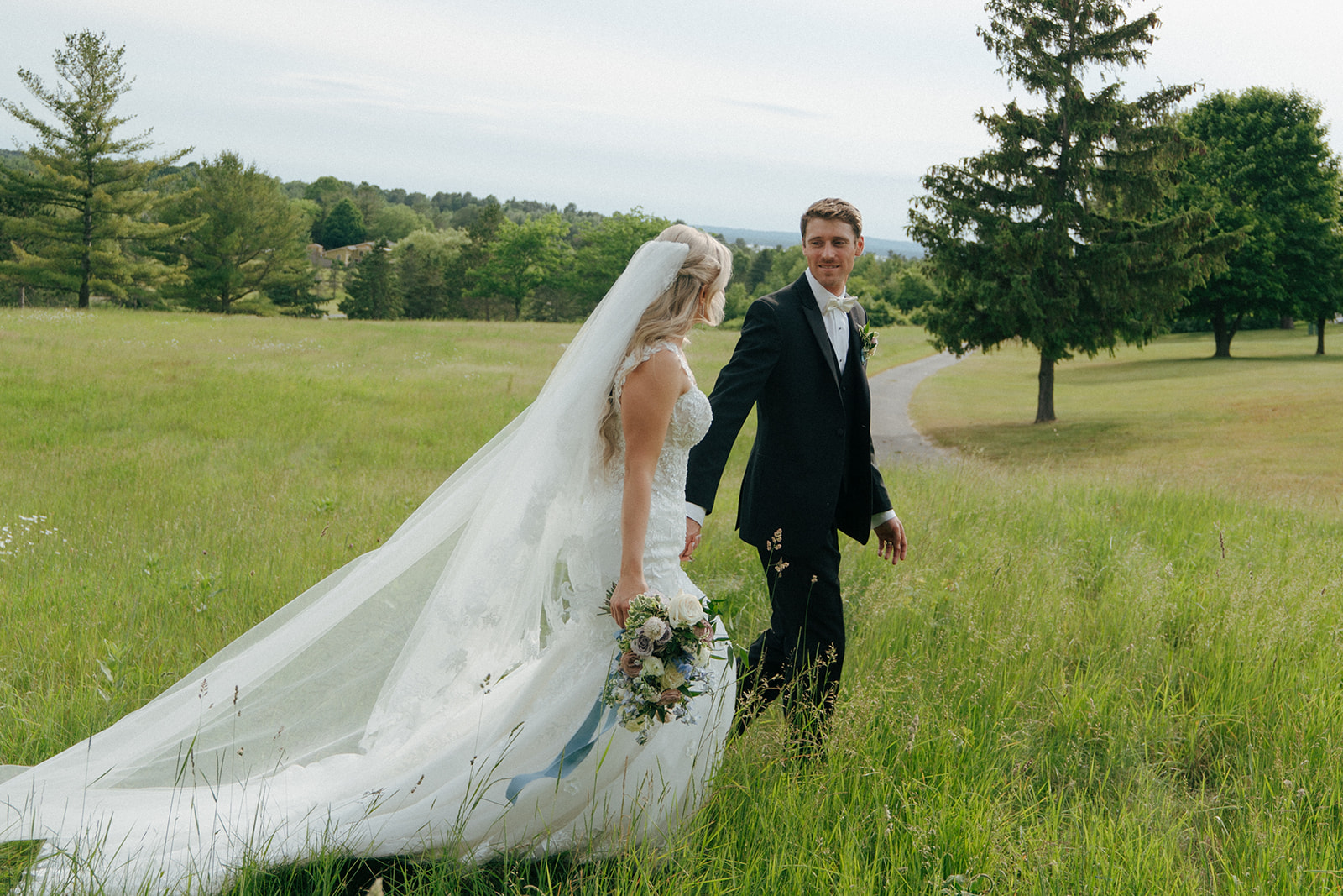 bride and groom walking around their wedding venue