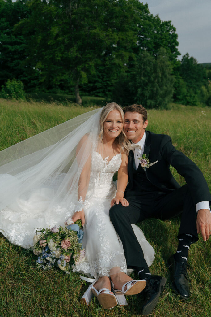 bride and groom looking at the camera