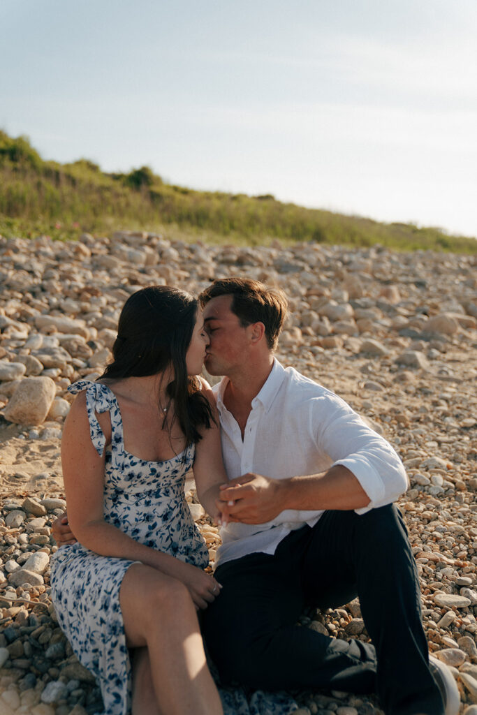 portrait of the newly engaged couple kissing