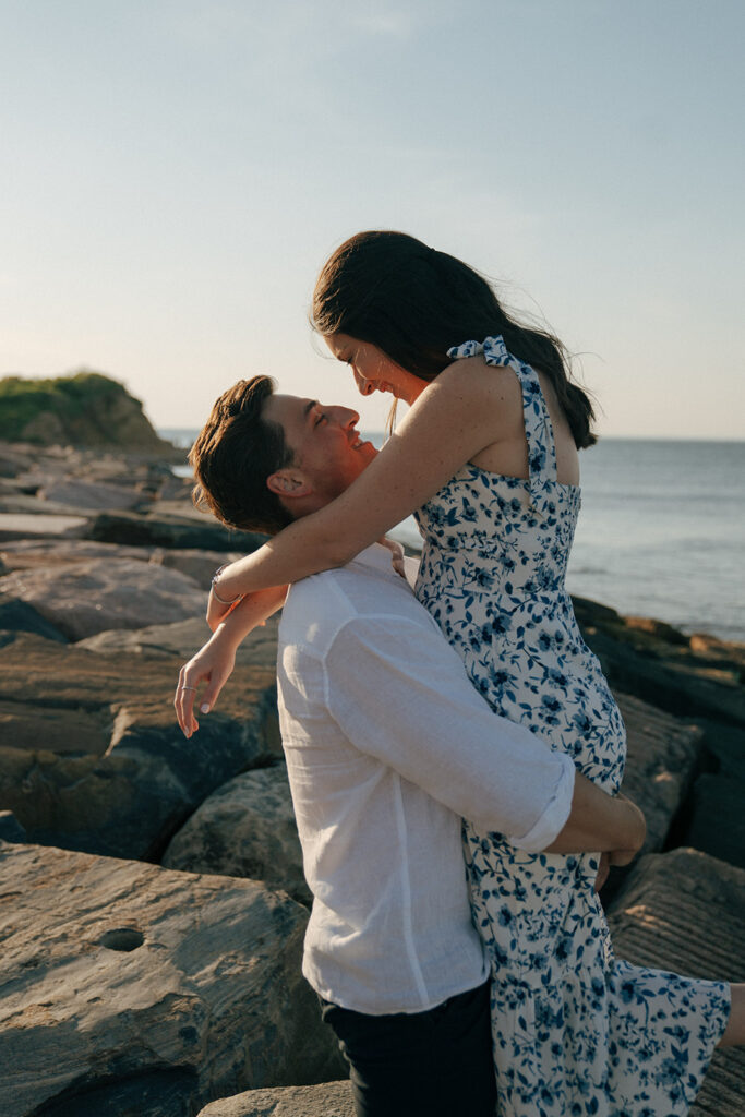 newly engaged couple looking at each other