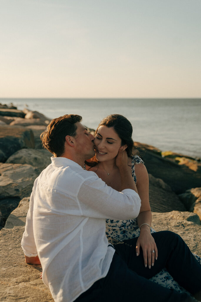 fiance kissing his fiance on the cheek