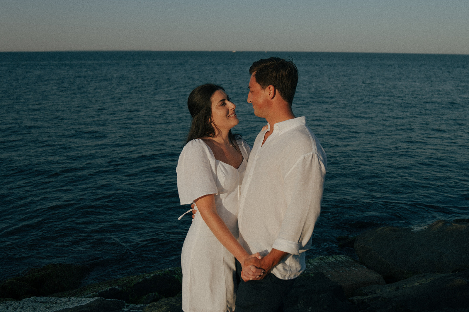 happy newly engaged couple looking at each other