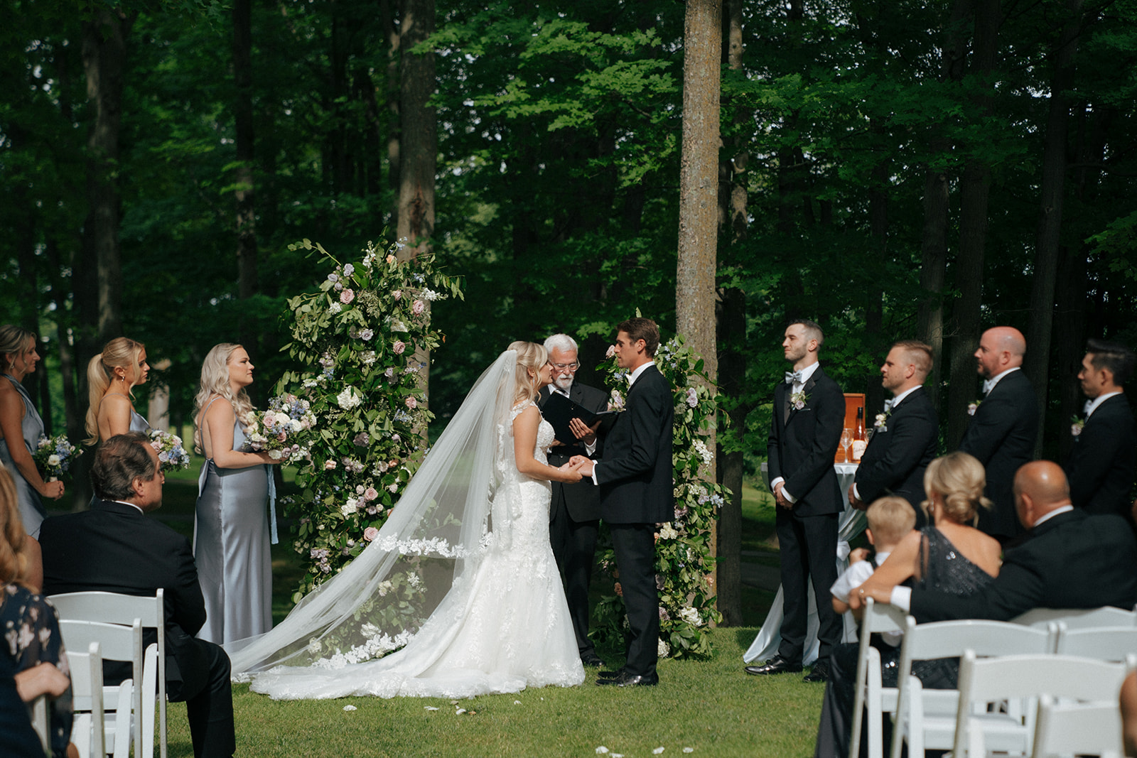 bride and groom holding hands during their beautiful wedding ceremony