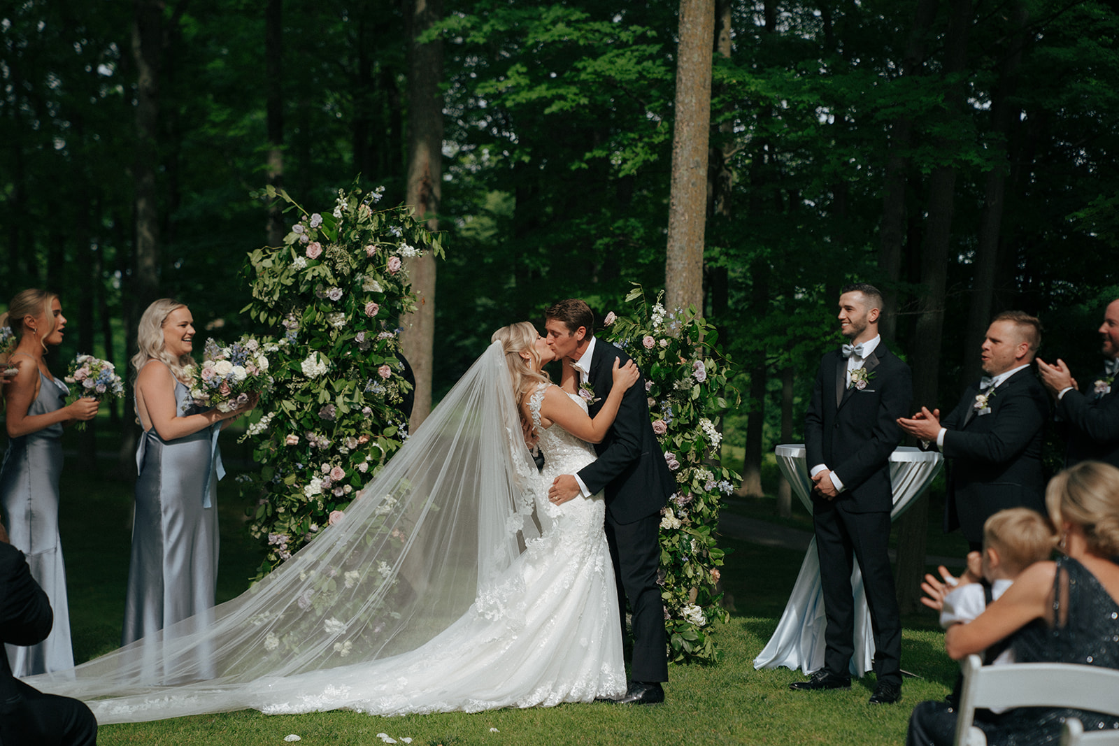 bride and groom kissing after their wedding ceremony their