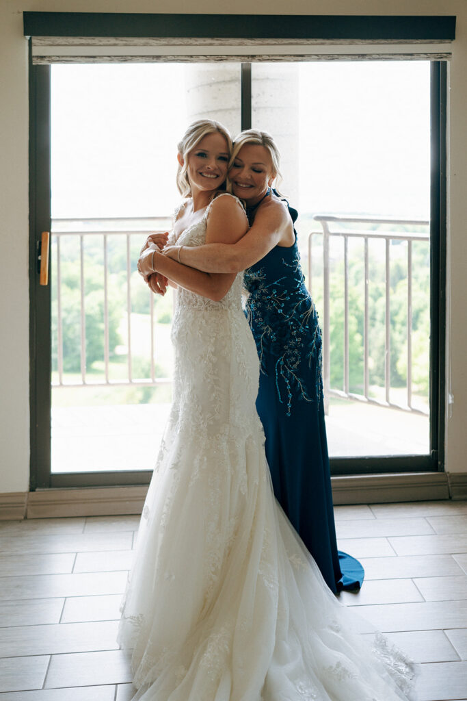 bride and her mom hugging