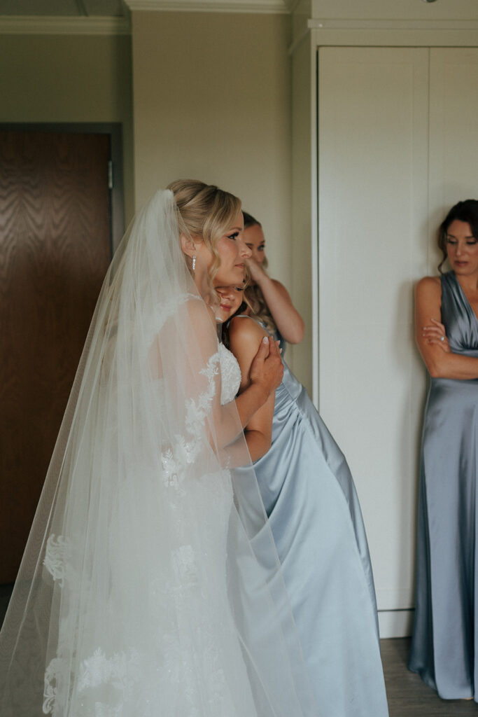 bride and her friends hugging