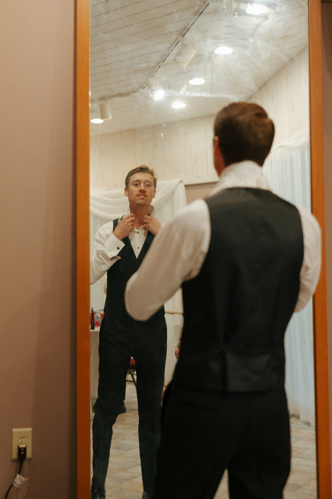 groom getting ready for his colorful wedding ceremony