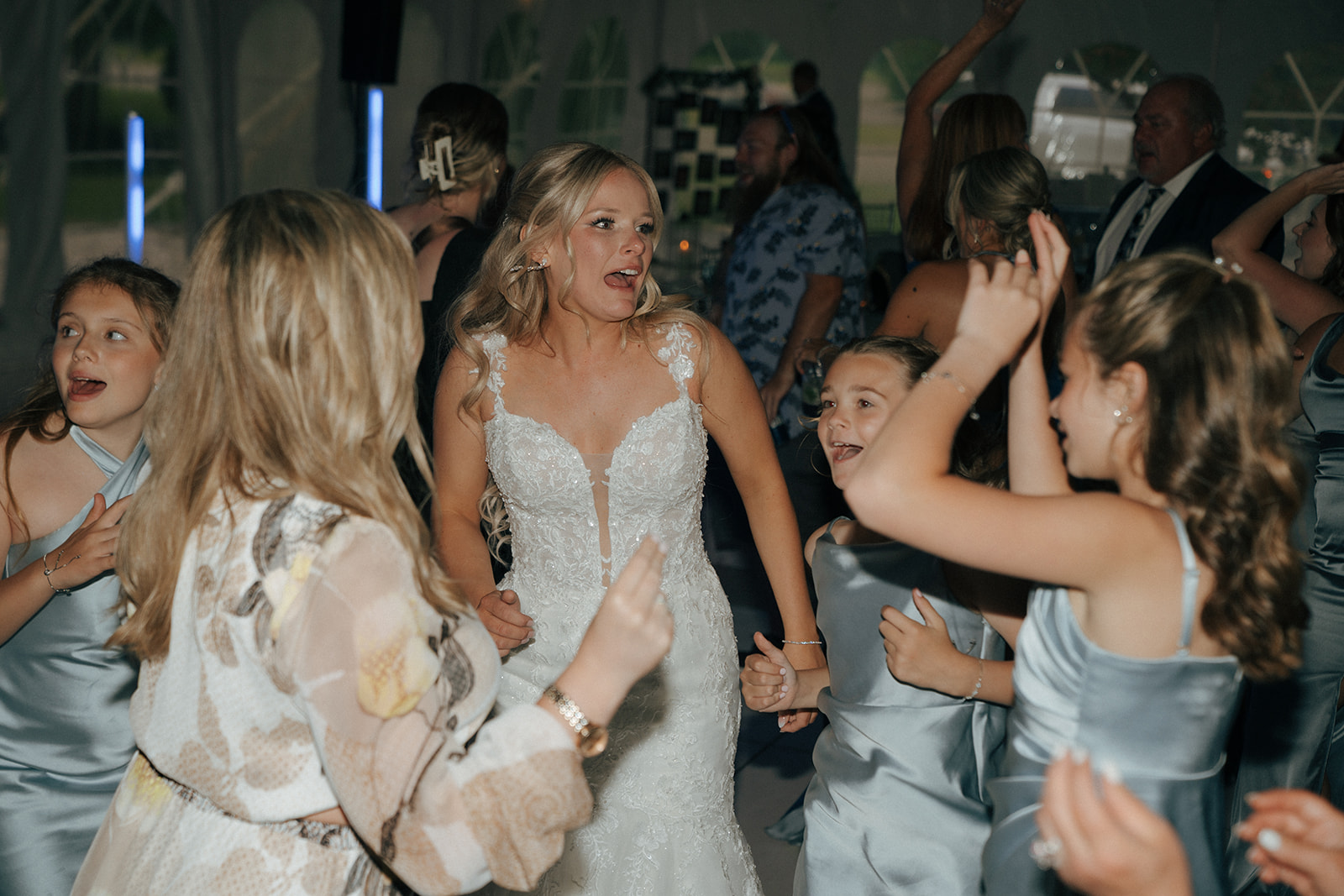 bride dancing at her colorful wedding reception party