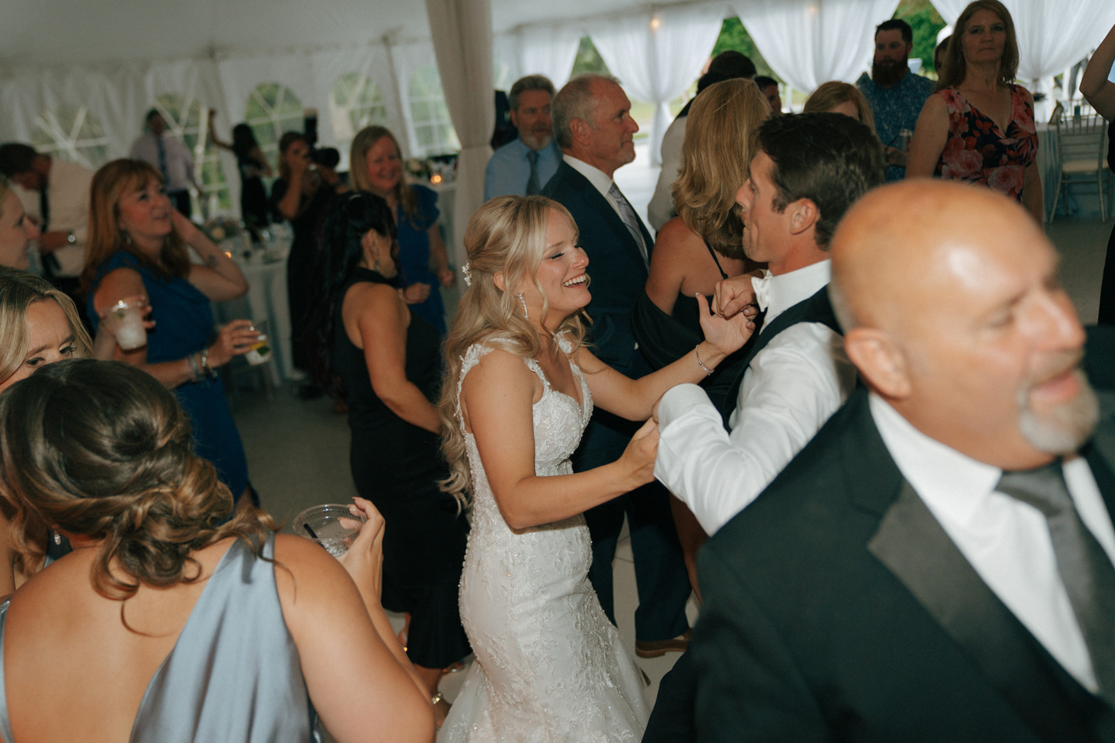 bride and groom dancing at their colorful wedding reception