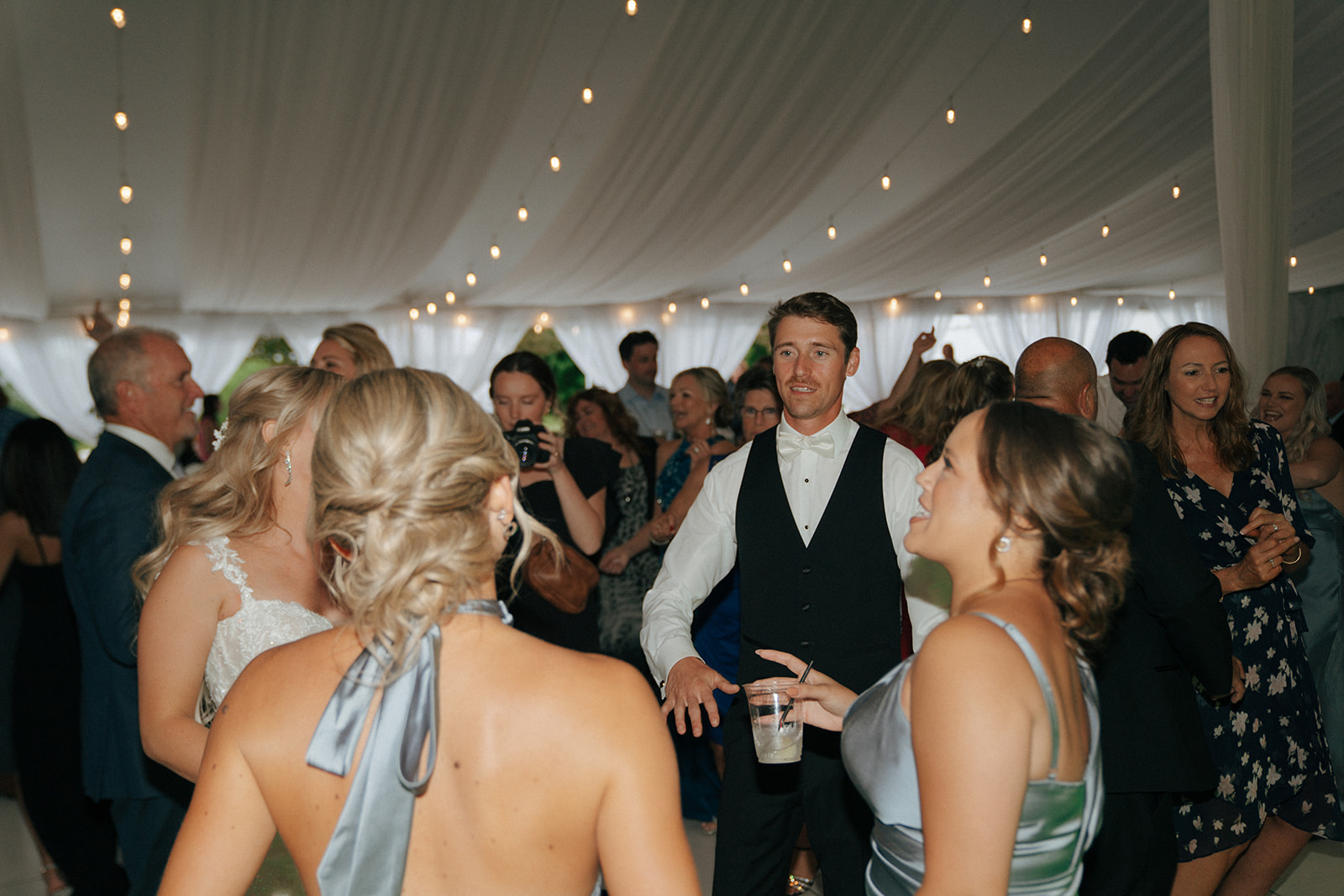 groom dancing at her wedding reception