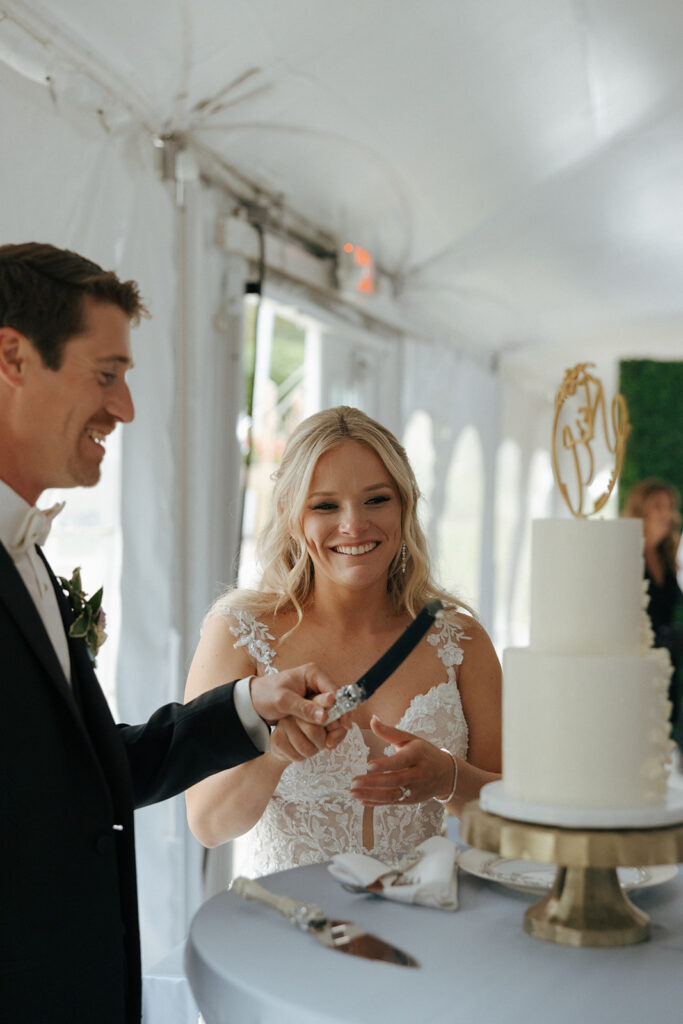 bride and groom cutting their wedding cake