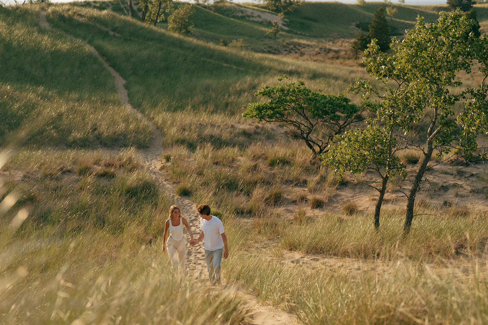 couple walking around during their fun engagement session