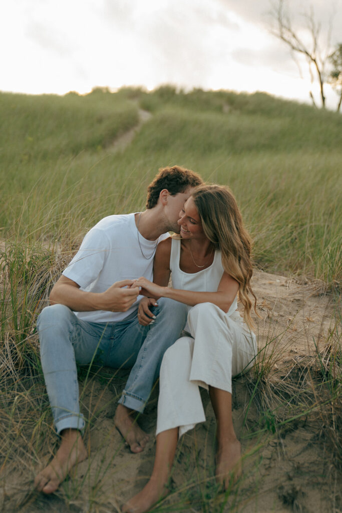 fiance kissing his fiance on the cheek