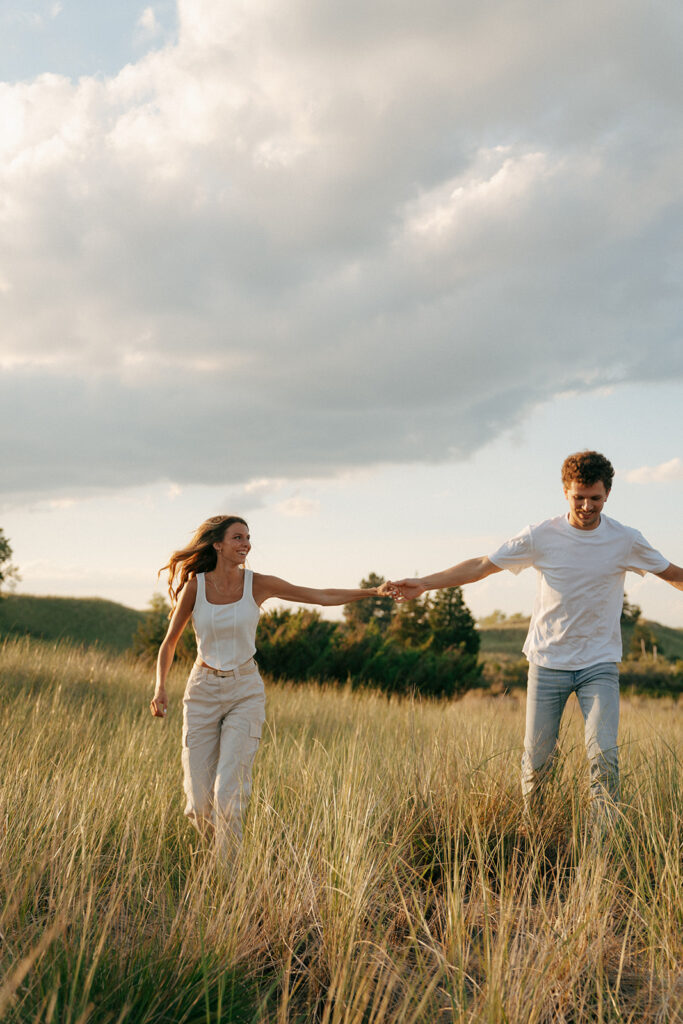 couple running around holding hands