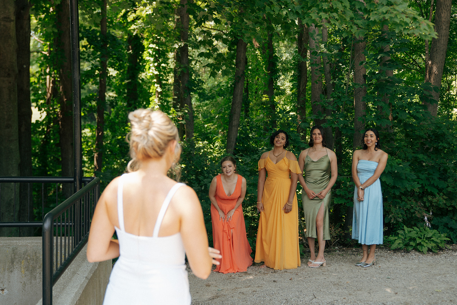 bride and bridesmaids first look