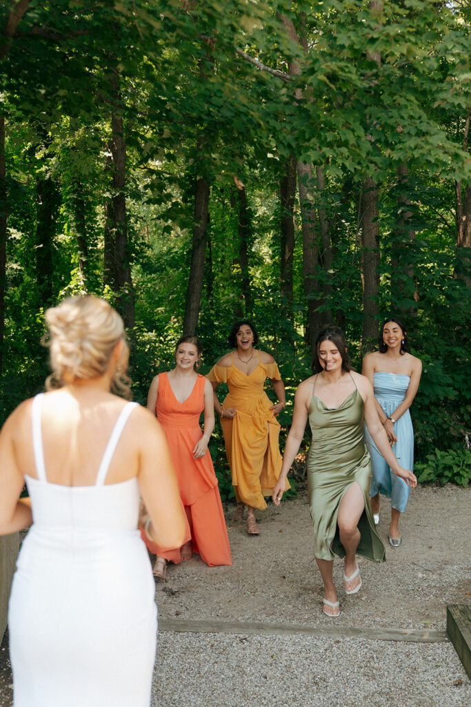 bride and her bridesmaids hugging