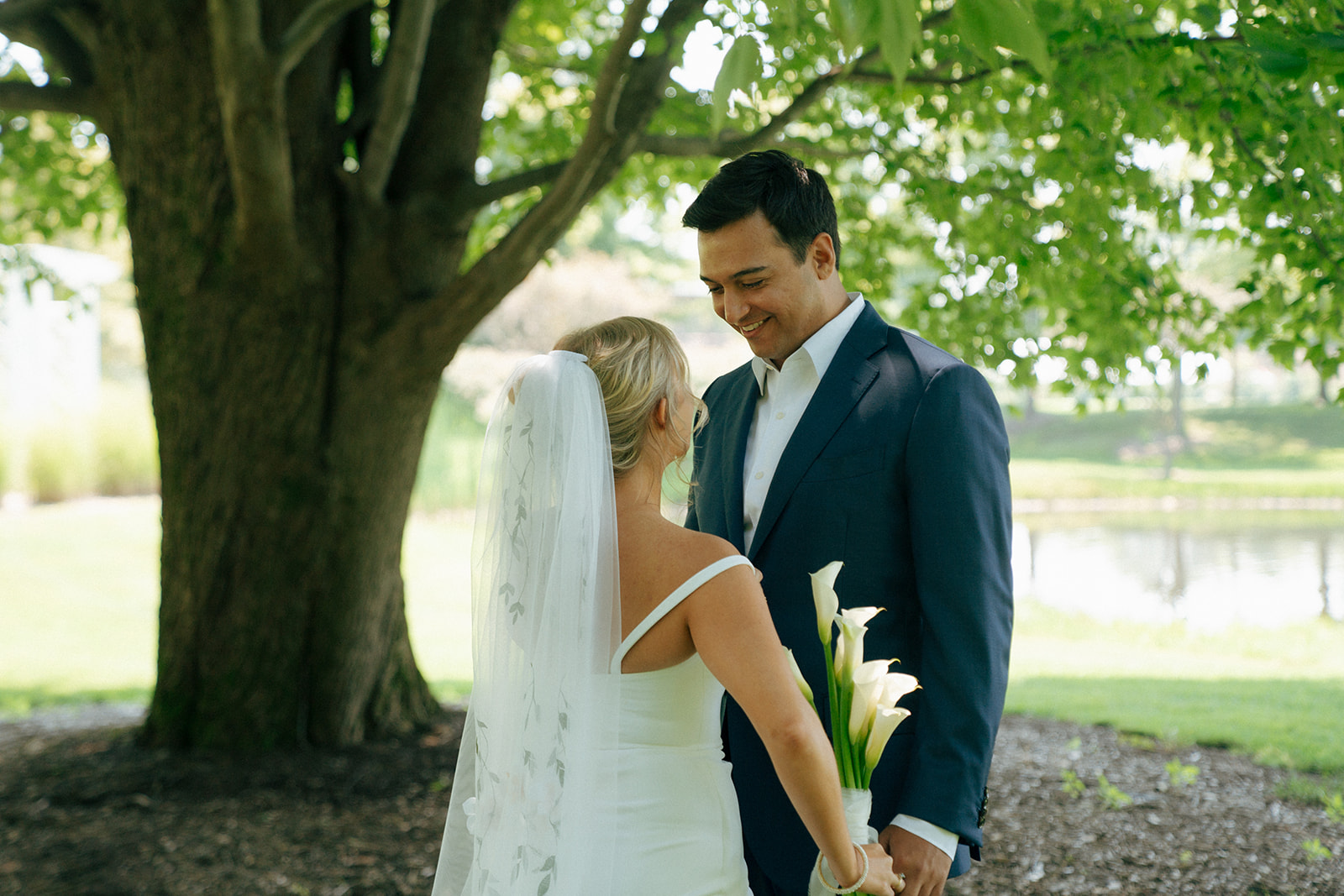 happy bride and groom looking at each other