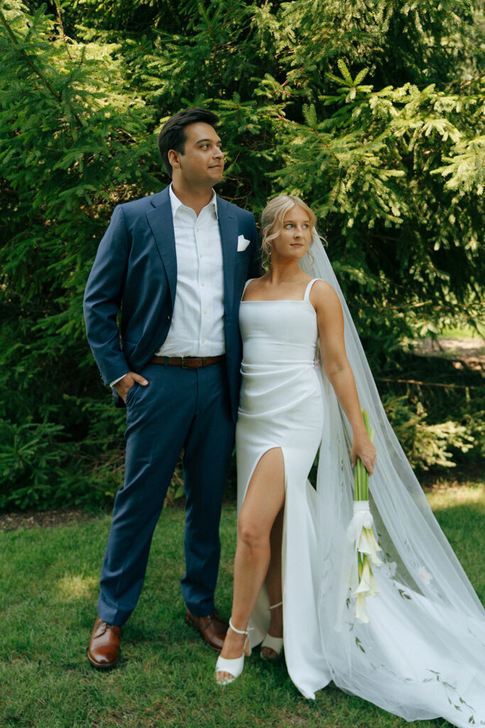 bride and groom posing for the camera during their bridal photoshoot