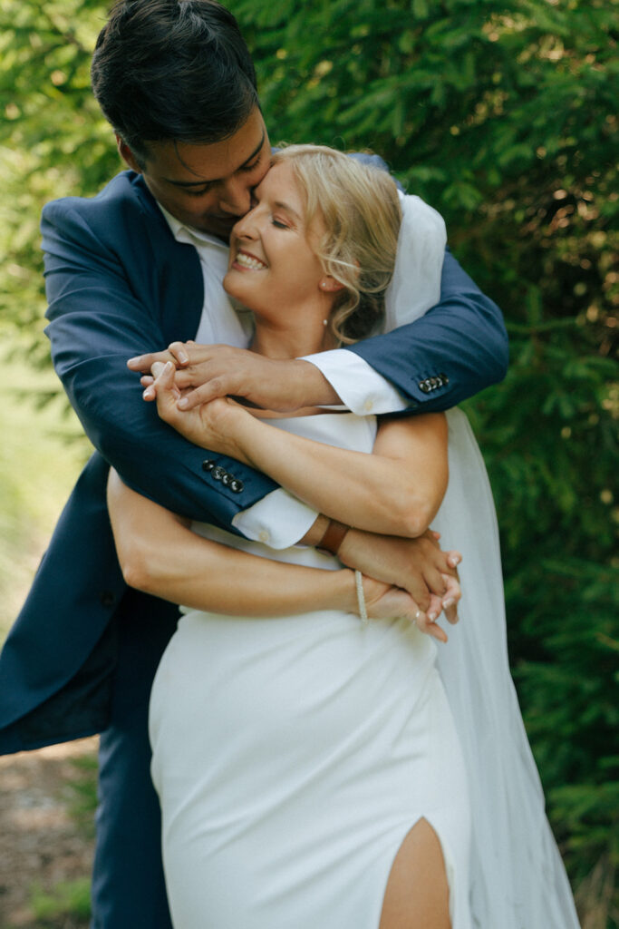 groom hugging the bride during their photoshoot