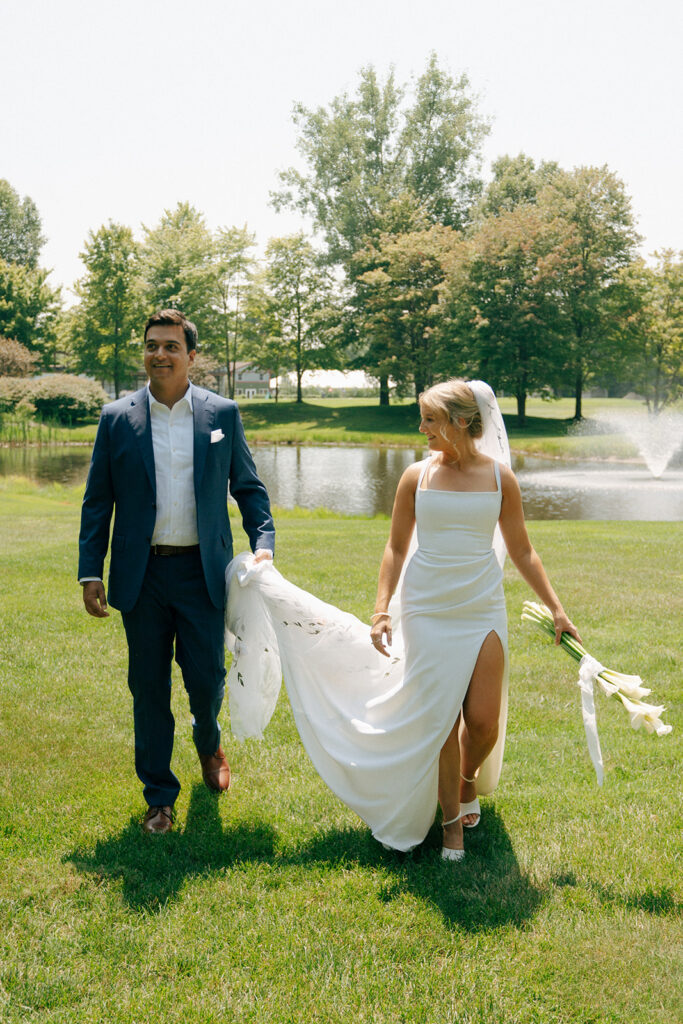 bride and groom walking around their wedding venue