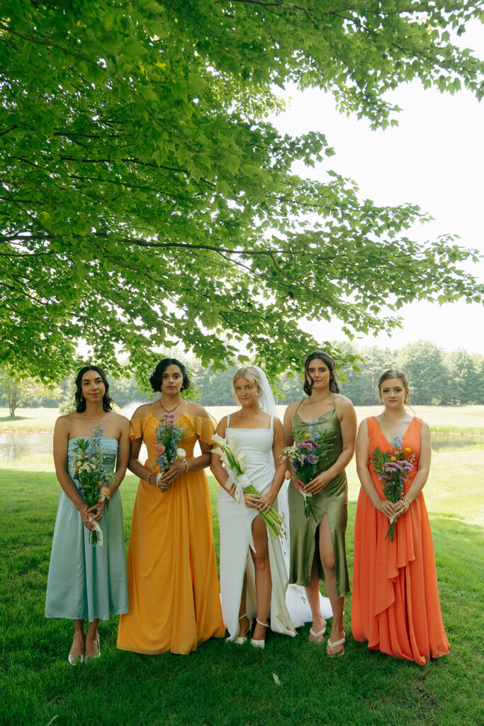 bride and her friends before the summer wedding ceremony