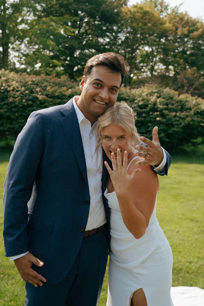 picture of the bride and groom showing their wedding rings