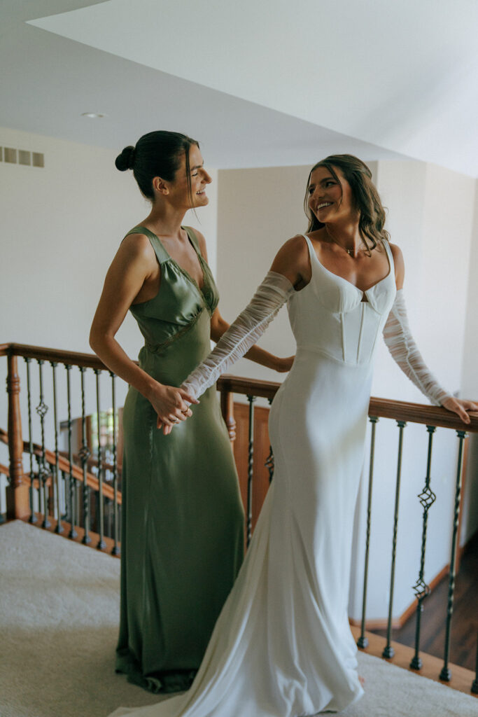 bride and her bridesmaid before the backyard wedding ceremony