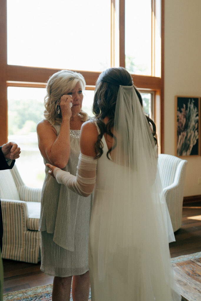 bride and her mom hugging