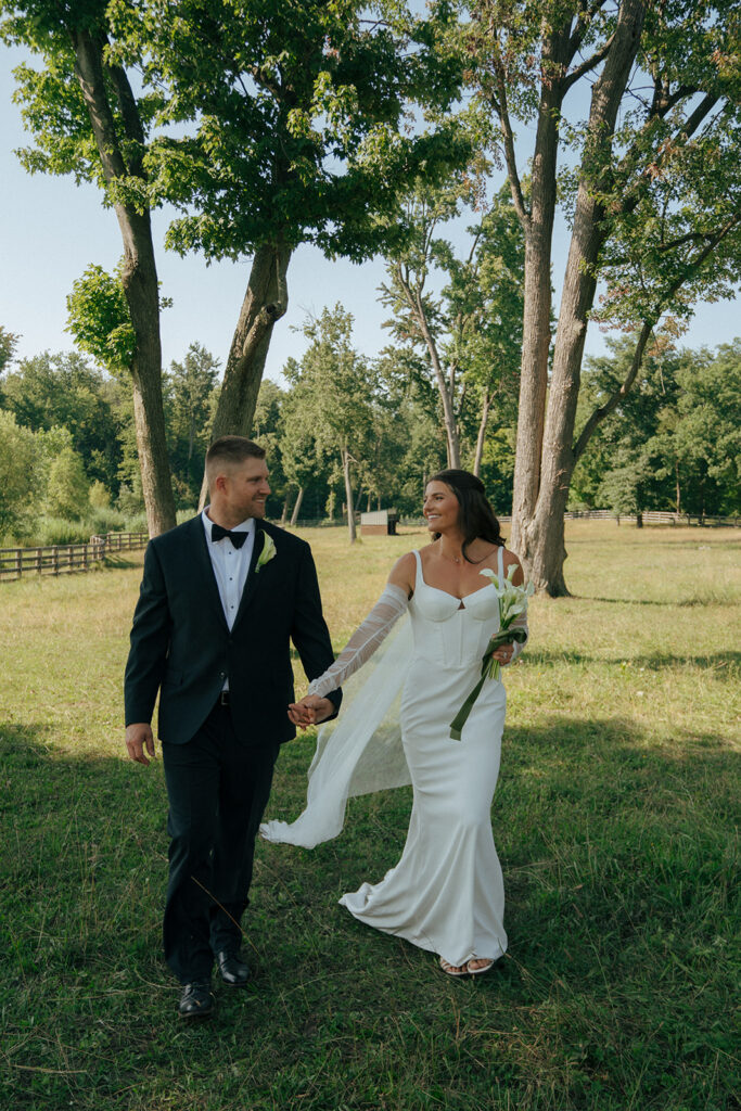 bride and groom walking around their wedding location