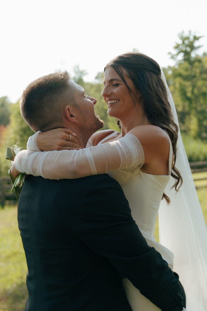 bride and groom hugging after their wedding ceremony