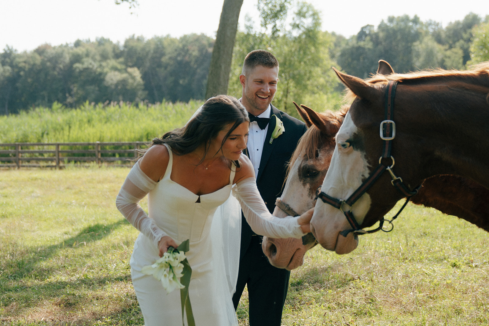 picture of the bride and groom with their horses