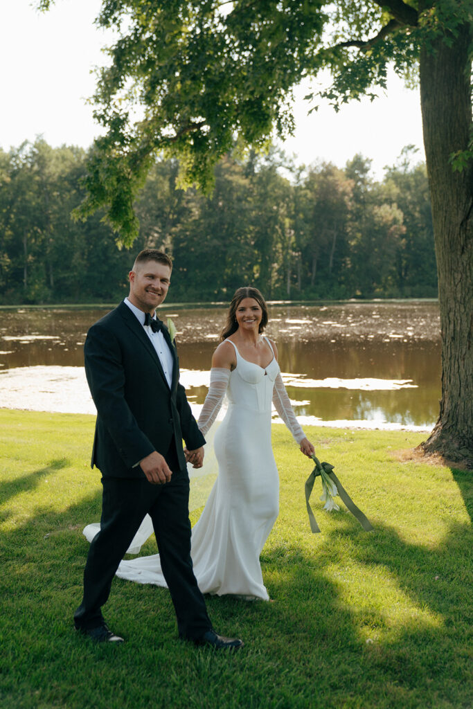 bride and groom walking around their farm