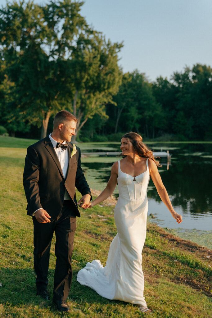 couple holding hands looking at each other