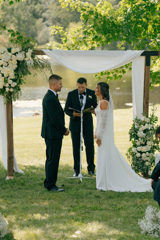 bride and groom looking at each other during their wedding ceremony