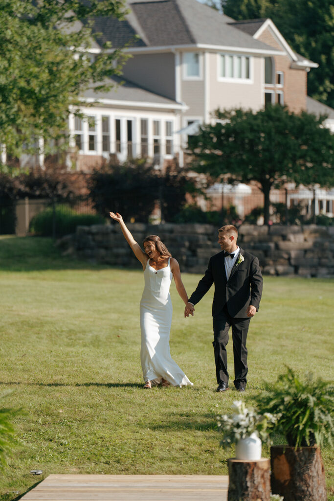 bride and groom arriving at their wedding reception