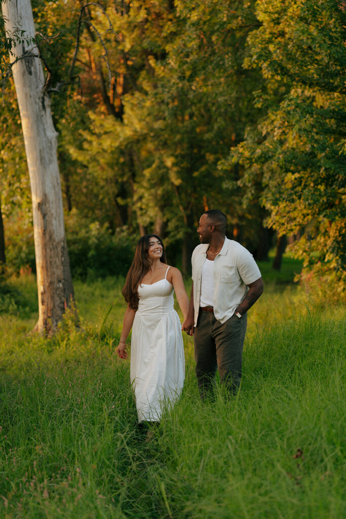 couple walking around riverside park