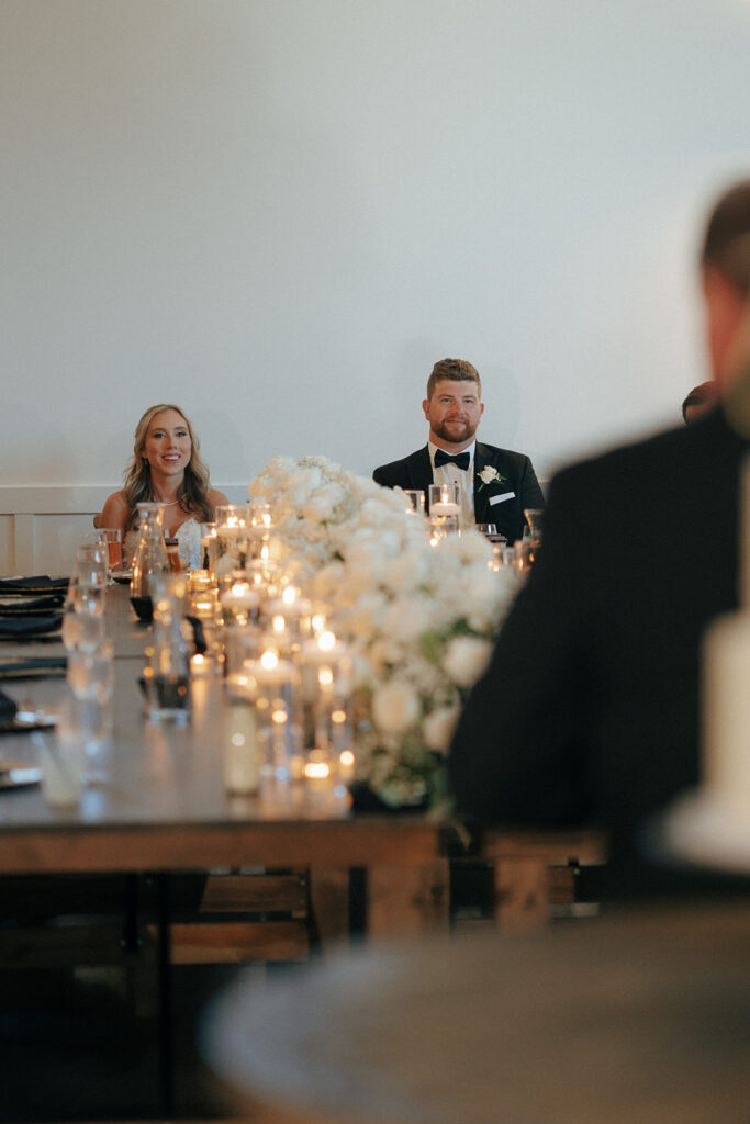 bride and groom at their wedding speeches