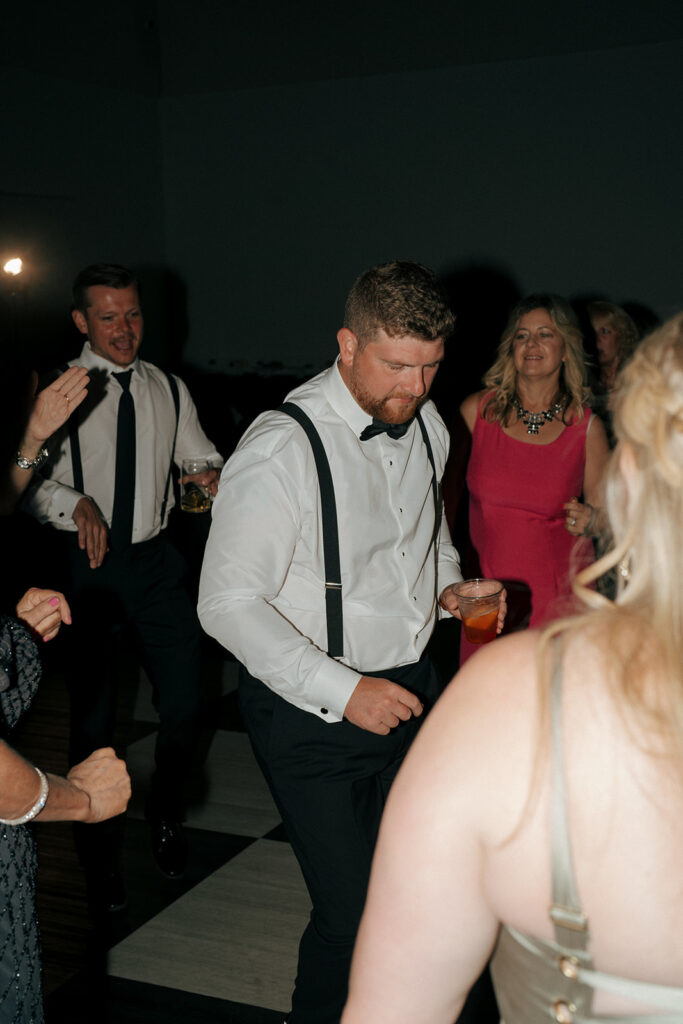 groom dancing at his wedding party