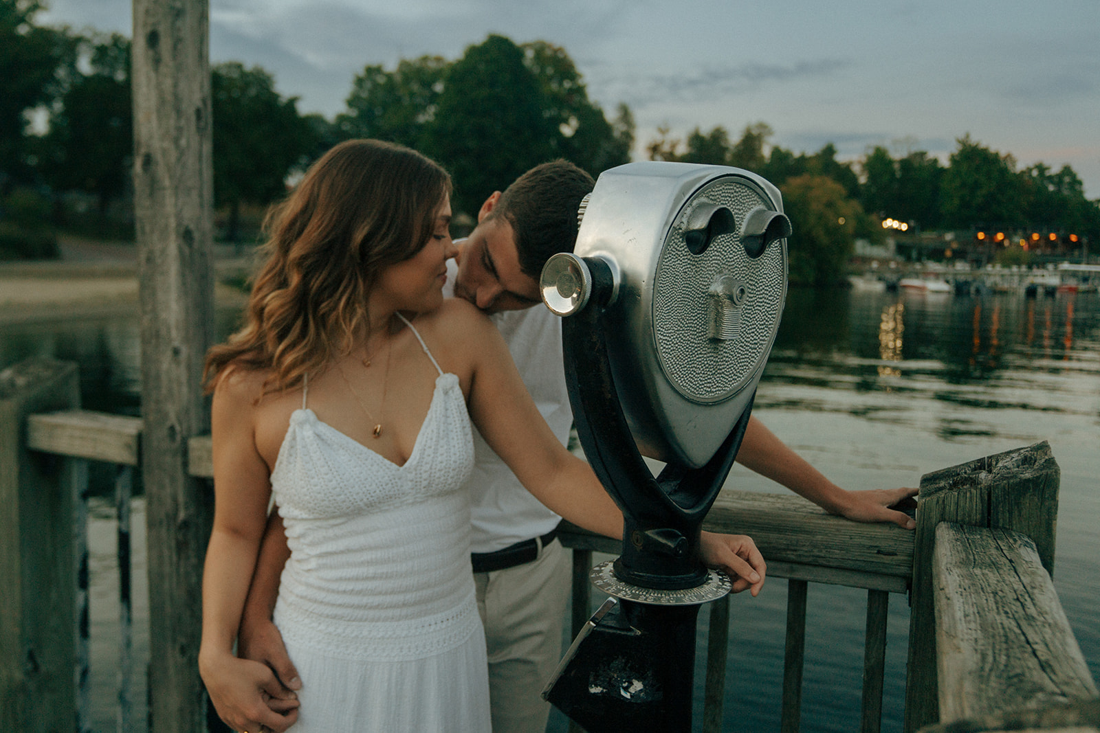 boyfriend kissing his girlfriend on the shoulder