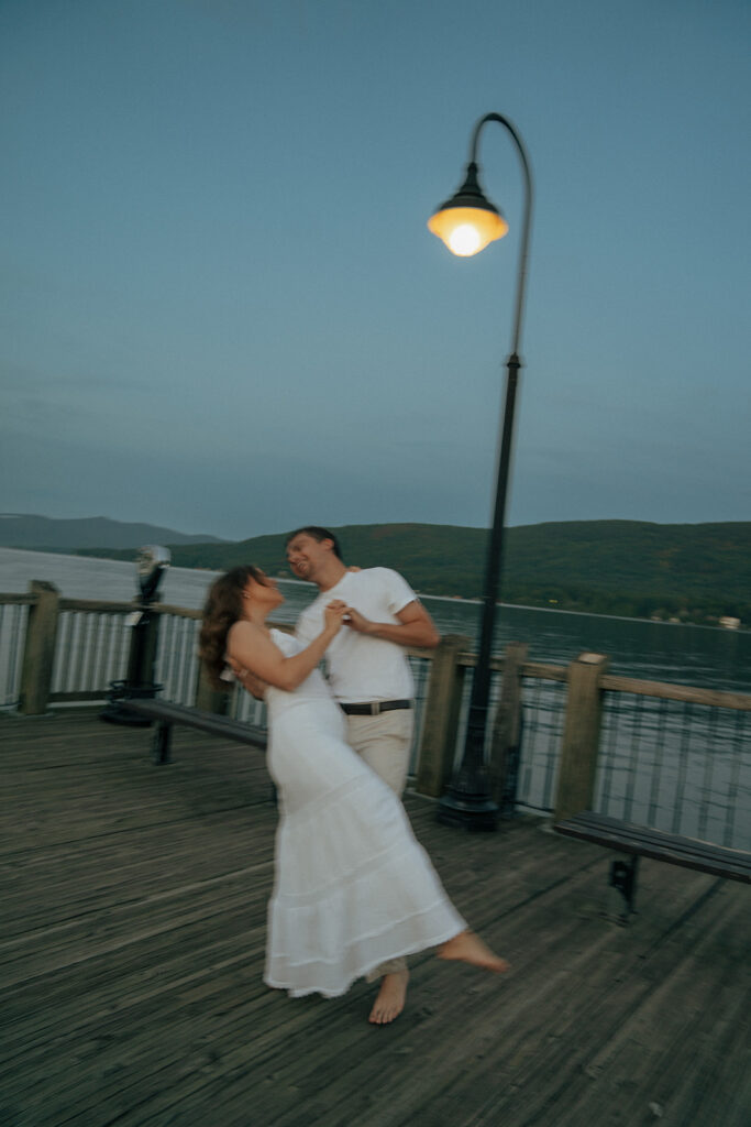 couple laughing with each other during their moody couples session