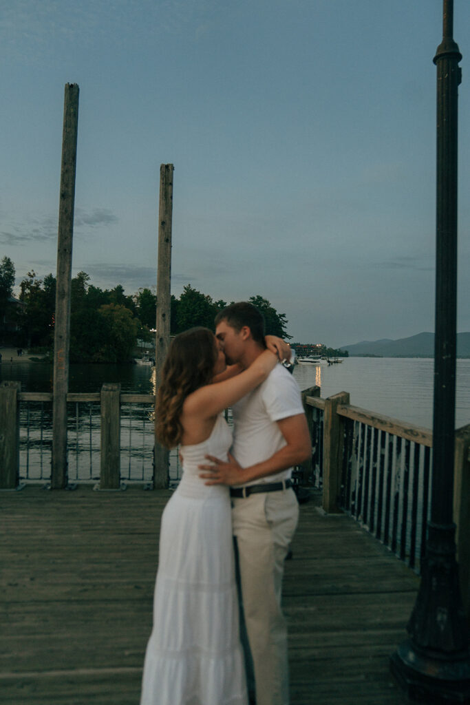 couple kissing at lake george in new york