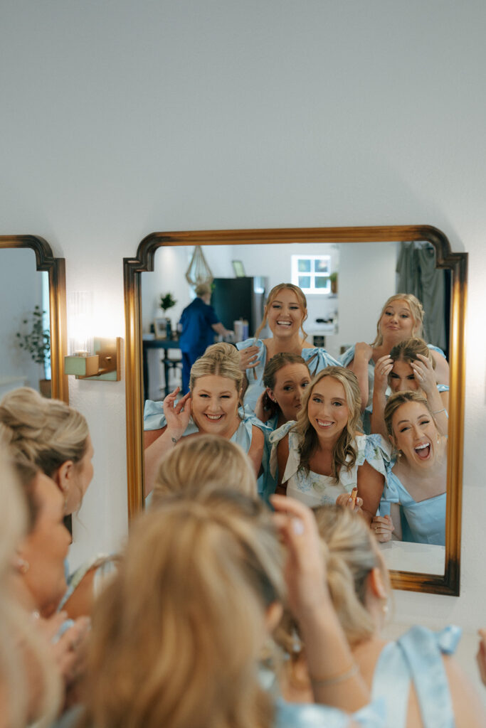 bride and her bridesmaids getting ready for the timeless wedding ceremony