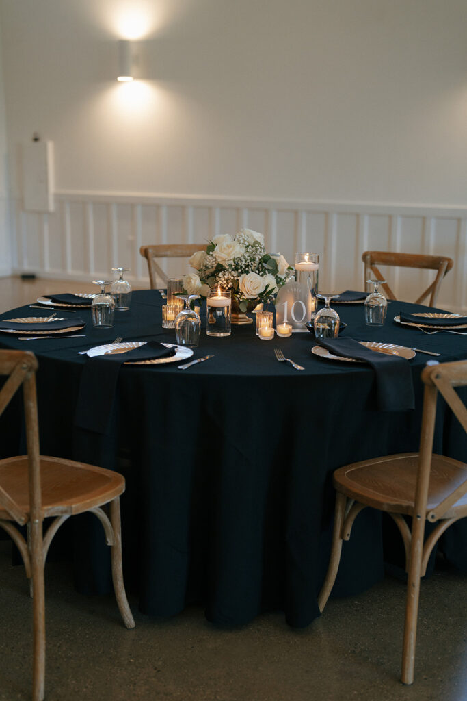 elegant wedding decor with white roses and black accents