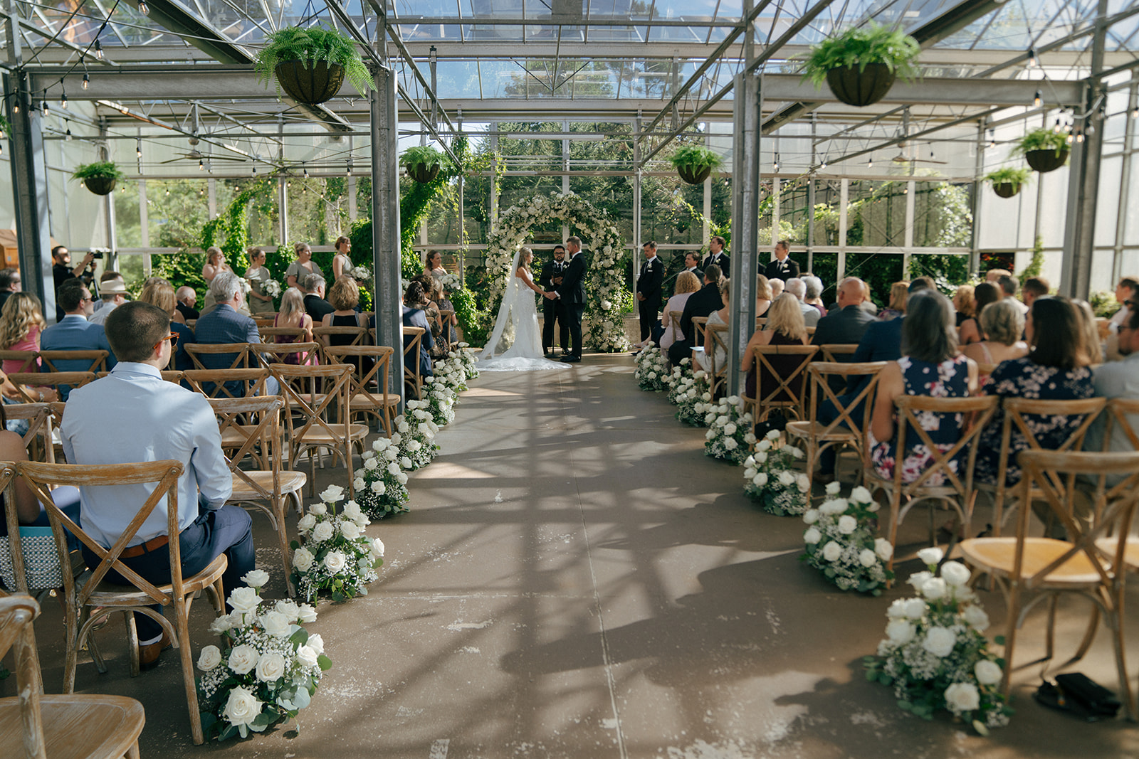 bride and groom holding hands during their wedding ceremony