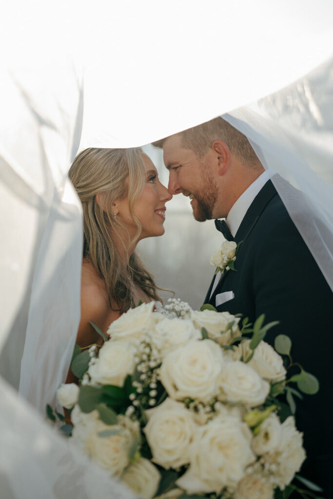 couple laughing with each other during their bridal photoshoot