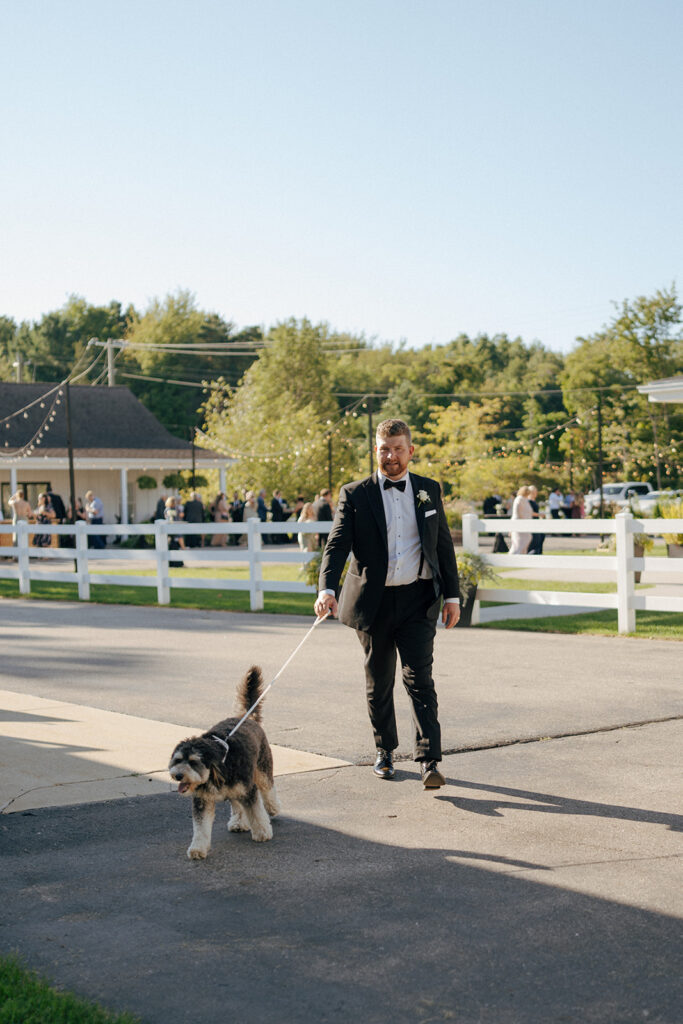 groom with his dog at the wedding