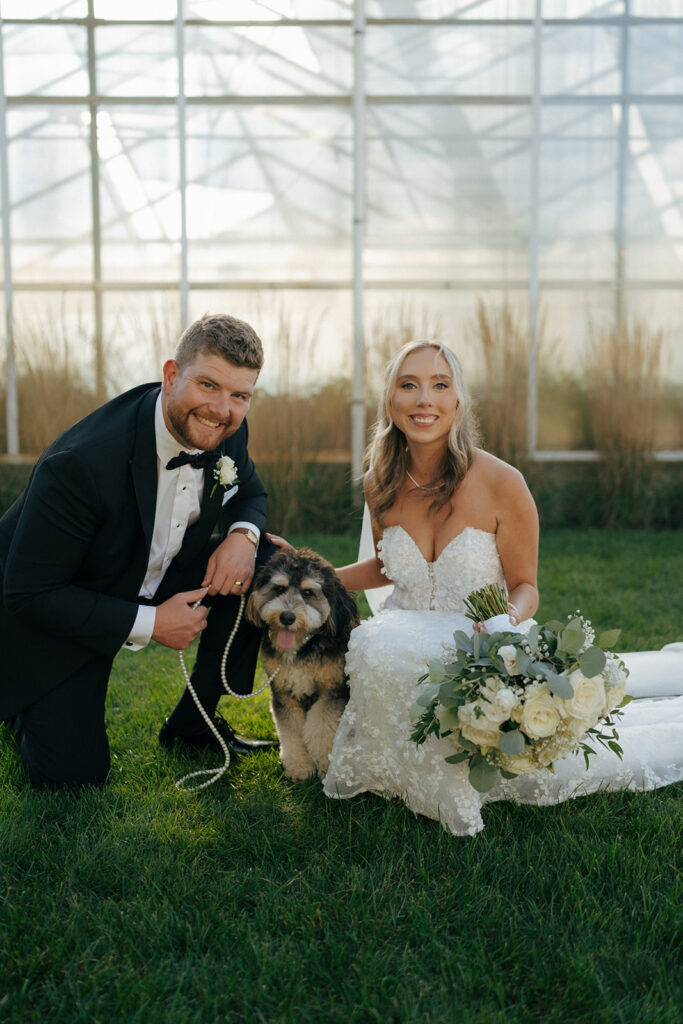 cute picture of the bride and groom with their dog