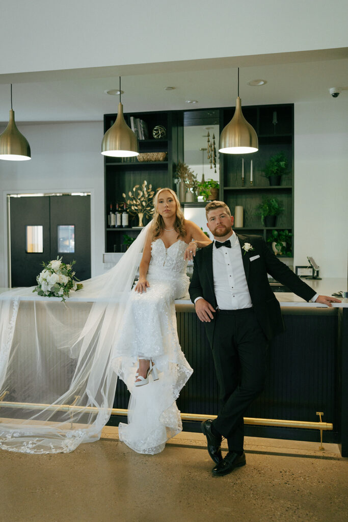 bride and groom looking at the camera