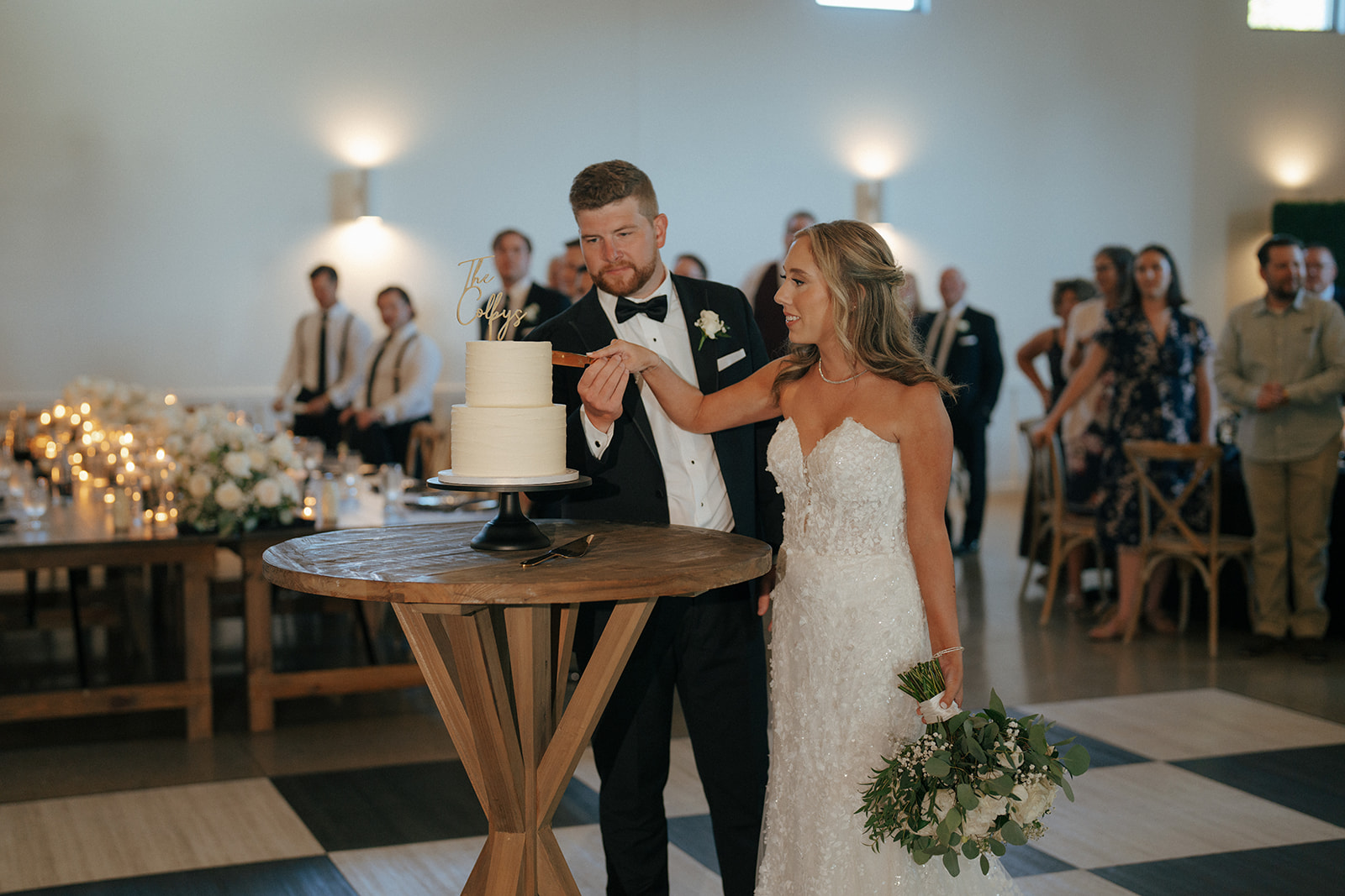 bride and groom cutting their wedding cake