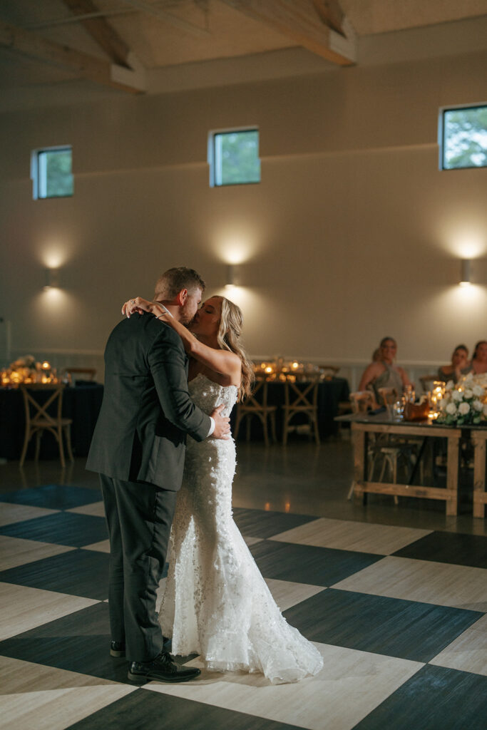 couple kissing after their first dance